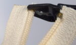 Pressing the zip fastener top stop with jewelry pliers