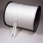 S0 continuous spiral zipper chain on 300 m roll, raw white TA030, with gaps every 100 m