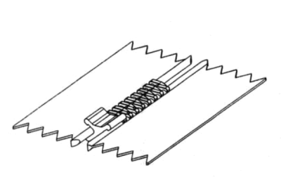 Mount x-shaped bottom stop on zipper using MPP: 1st step